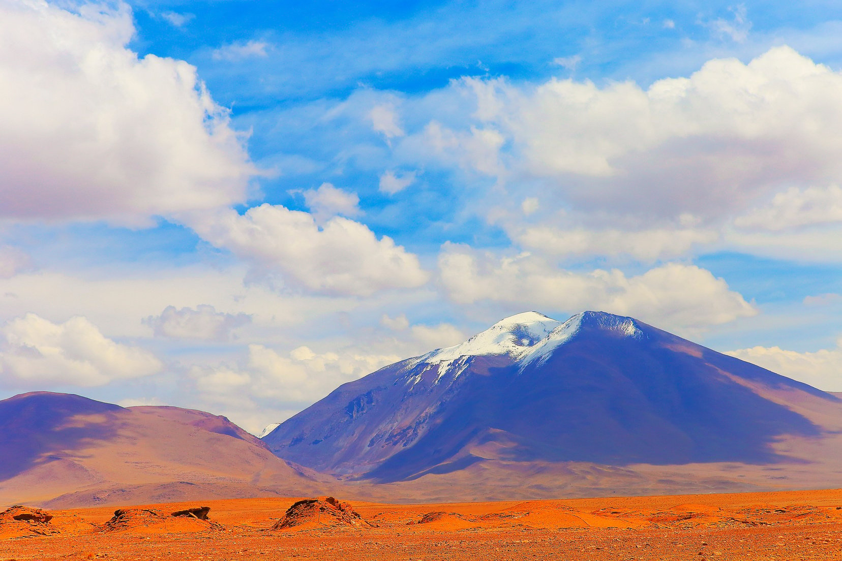 Snowcapped active Lascar volcano, Atacama Desert Volcanic landscape –  Chile